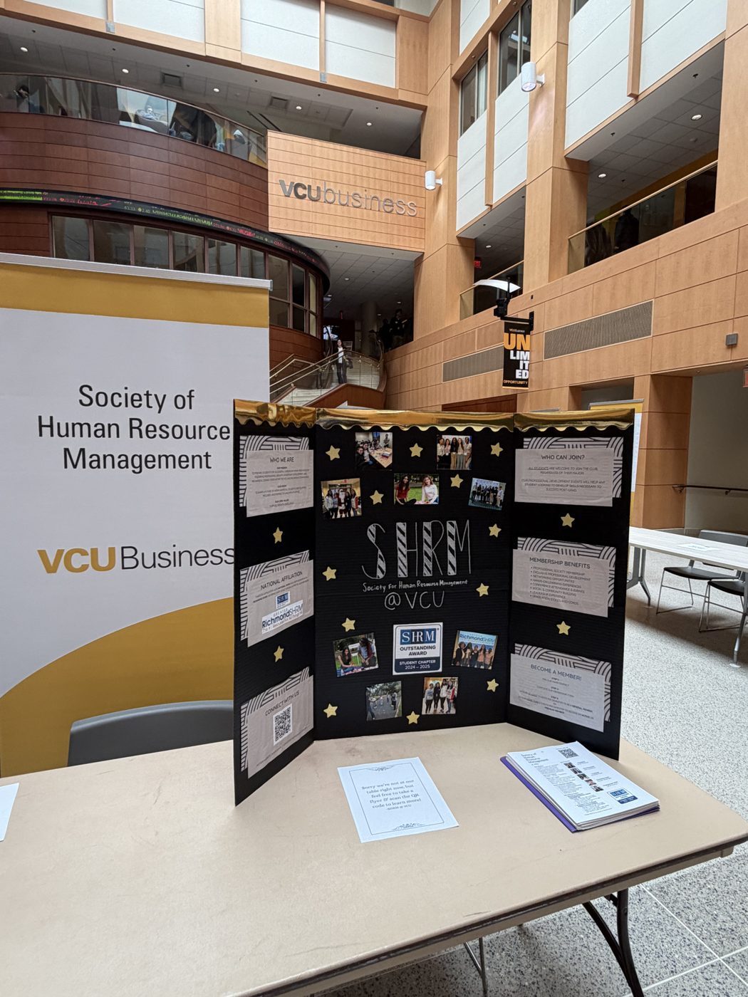 The SHRM at VCU display board at a tabling event in the VCU Business atrium